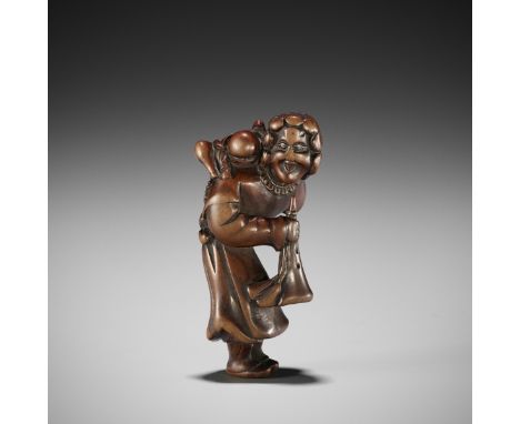 A GOOD WOOD NETSUKE OF A DUTCHMAN WITH CHILDUnsignedJapan, 18th century, Edo period (1615-1868)Typically depicted with should