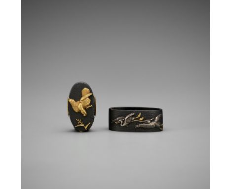 TAKASE EIJU: A MASTERFUL TAKASE SCHOOL SHAKUDO KASHIRA AND FUCHI DEPICTING A FALCONS HUNTING EGRETSBy Takase Eiju (1775-1800)