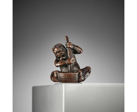ITTAN: A FINE NAGOYA SCHOOL WOOD NETSUKE OF AN ONI WITH MORTAR AND SKULLBy Ittan, signed Ittan 一旦 with kakihanJapan, Nagoya, 