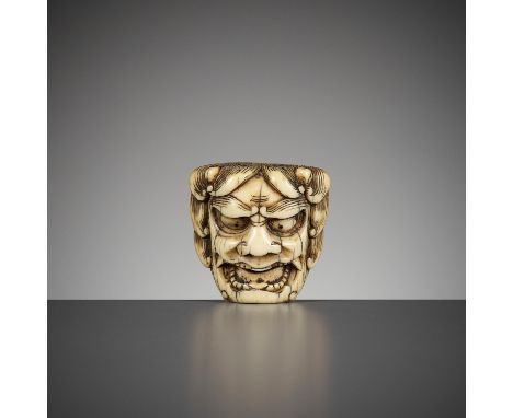 AN IVORY MASK NETSUKE OF AN ONIUnsignedJapan, 18th century, Edo period (1615-1868)Finely carved as an oni with fierce express