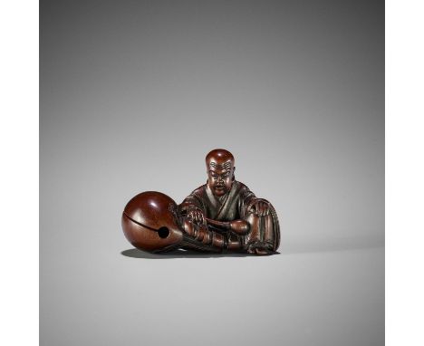 SHURAKU: A FINE WOOD NETSUKE OF A MONK WITH MOKUGYOBy Shuraku, signed Shuraku 舟樂with kakihanJapan, Edo, first half of 19th ce