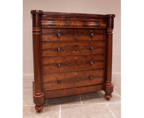 A Victorian mahogany Scottish chest of drawers, the cushion shaped frieze drawer above an arrangement of two short and three 