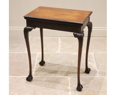 An Edwardian mahogany Chippendale revival games table, the rectangular hinged top with a gadrooned edge opening to a baize li