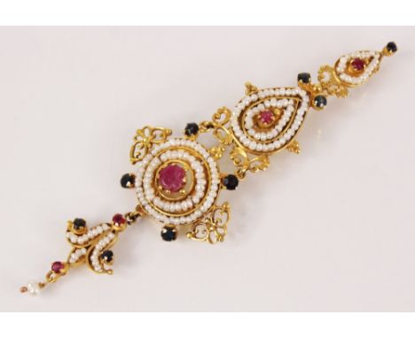 An Indian pearl, ruby and sapphire articulated brooch pin, the gold coloured mount designed as two teardrops, suspending a ci