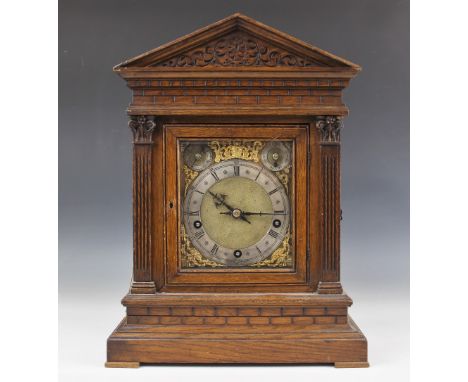 A late 19th/early 20th century German oak cased bracket clock by Winterhalder and Hofmeier, the architectural case with simul