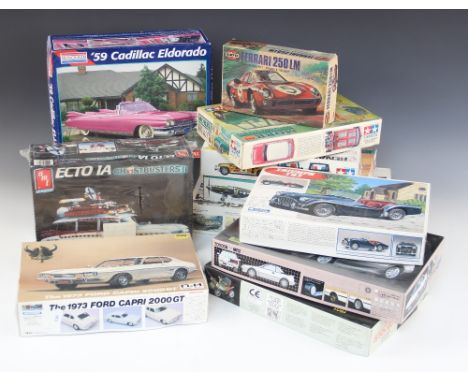 Nine unmade boxed plastic model vehicle kits, comprising: a Nostalgic Heroes 1973 Ford Capri 2000 GT; a Gunze Sangyo 1:24 sca