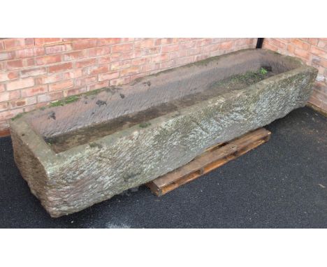 A large 19th century sandstone water trough/planter, of shallow rectangular form, 49cm H x 275cm W x 74cm D Interior depth 28