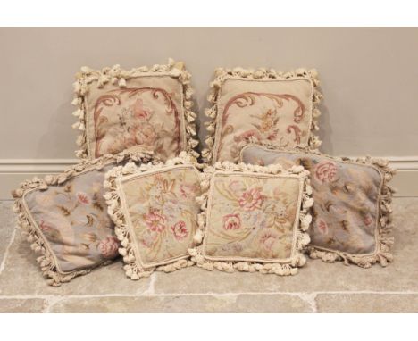 Three pairs of Aubusson style needle-point tapestry cushions, each worked with floral sprays in red, green and blue colourway
