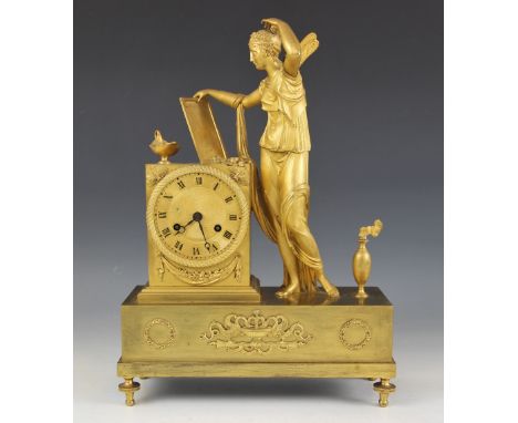 A late 19th century French gilt metal mantel clock, of podium form, the case surmounted with a figure of Psyche alongside the