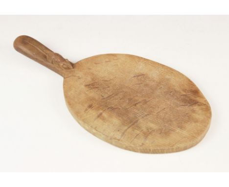 Workshop of Robert 'Mouseman' Thompson, Kilburn, a cheese board of oval form, with a carved trademark mouse to the handle, 38