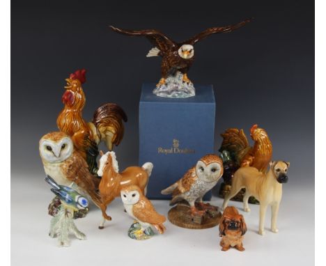 Five Beswick animal models, comprising: a large Barn Owl, model No 1046; a small Barn Owl, model No 2026; a Bald Eagle, model