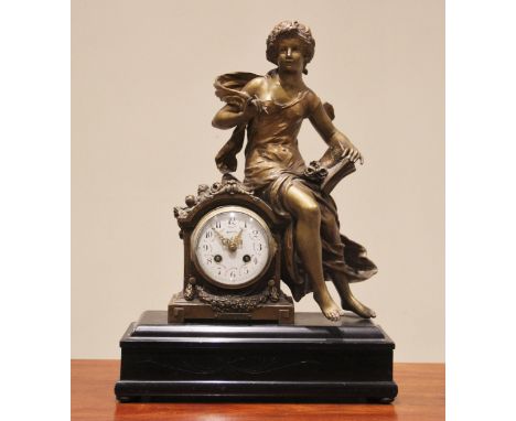 A late 19th century French spelter figural mantel clock, the case surmounted with a figure 'L'Historie' after Moreau, above t