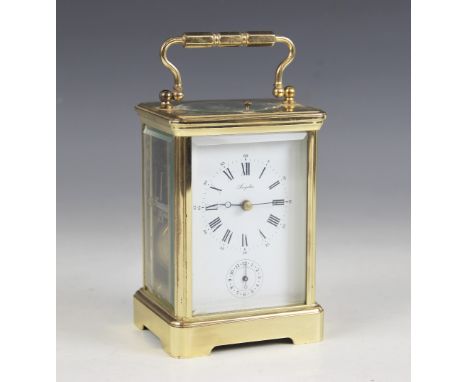 A French lacquered brass repeating carriage clock, the 7cm white dial signed Angelus with subsidiary alarm dial, enclosing th