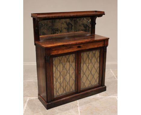A Regency rosewood mirror back chiffonier, the rectangular mirror back below a three quarter galleried shelf and above the re