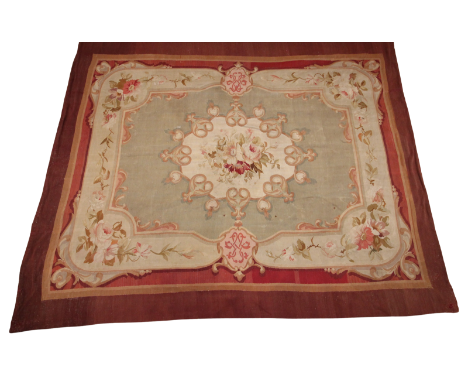A very large Aubusson style needle-point wall hanging, in fawn, terracotta and green colourways, the central floral spray emb