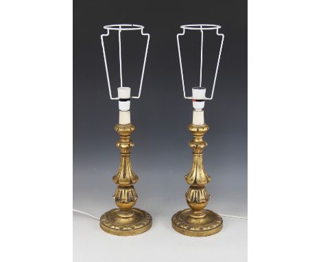 A pair of turned and carved effect table lamps, each with aged gilt effect finish, each 40.5cm high to top of fitting, with a