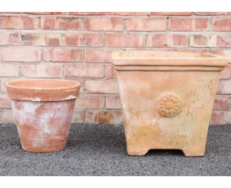 A terracotta planter, of cubic form, moulded in relief with roundel detail, 43cm H x 48cm Sq, along with a terracotta planter