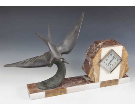 A 1930's French Fexacta Art Deco mantel clock, the plinth surmounted with a bronzed spelter bird in flight, signed 'G. Franjo