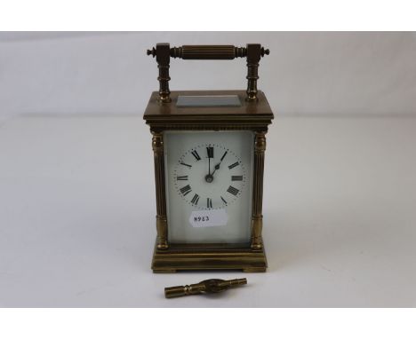 A French made brass carriage clock with white enamel dial, complete with key. 