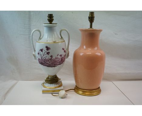 A pink ground ceramic baluster shaped lamp together with a Richard Ginori urn shaped lamp with mask and rural scene decoratio