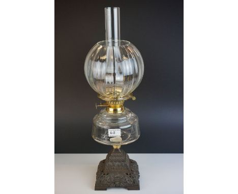 Victorian Oil Lamp with clear glass well and stepped cast iron base, bulbous fluted clear glass shade and chimney, 60cms high