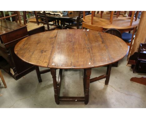 18th century style Oak Oval Gate-leg Table raised on turned and block supports, approx. 111cms long x 74cms high 