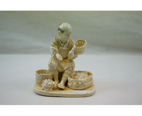 Ceramic Okimono Style Figure of a Fisherman with catch 
