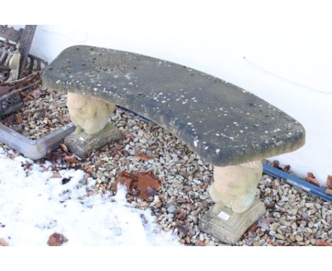 A composite stone garden bench of curved form with Squirrel supports. 