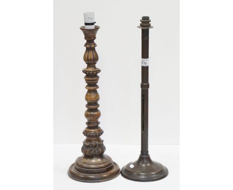 An arts and Crafts style brass lamp together with a turned treen lamp with leaf decoration. 