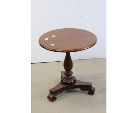 William IV Mahogany and Rosewood Circular Wine / Lamp Table raised on a turned baluster column support and a platform base wi