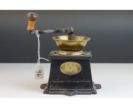 An early 20th century E Pugh and Co  cast iron coffee grinder. 
