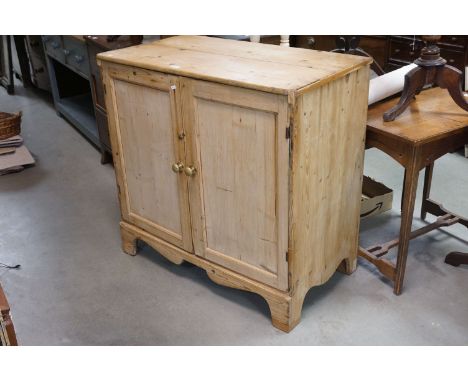 19th century Pine Cupboard, the two panel doors opening to reveal a shelf, raised on bracket feet, 98cms wide x 96cms high 