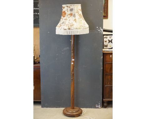 South East Asian Hardwood Standard Lamp, the turned column carved with a twisting panel of flowers, 157.5cms high 