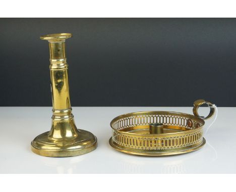 A brass chamber stick and a Telescopic brass candlestick.