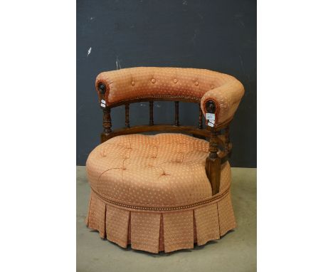 Victorian Low Armchair, the bow back with button upholstered top rail and turned spindle supports, circular button upholstere