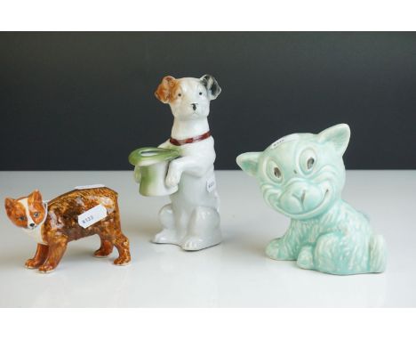 A green Sylvac style dog, a ceramic terrier holding a hat and a Rushton Pottery Isle of Mann Manx cat 