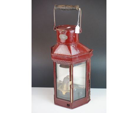 Eli Griffiths &amp; Sons of Birmingham Ships Lamp, Maroon finish, 1918, with exterior wick adjust, 52cms high (to top of hand