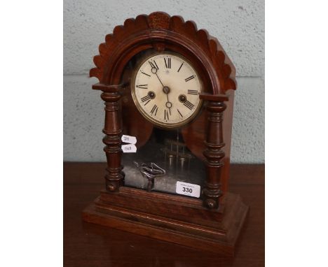 Early 1900s mantle clock with its key in good order 
