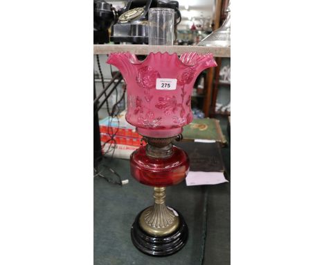 Oil lamp with cranberry glass shade and reservoir 