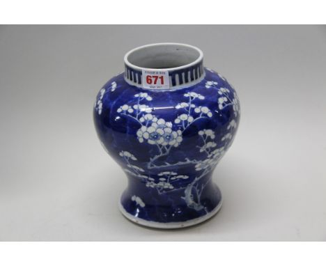 A Chinese blue and white inverted baluster prunus jar, Kangxi four character mark, 20cm high.