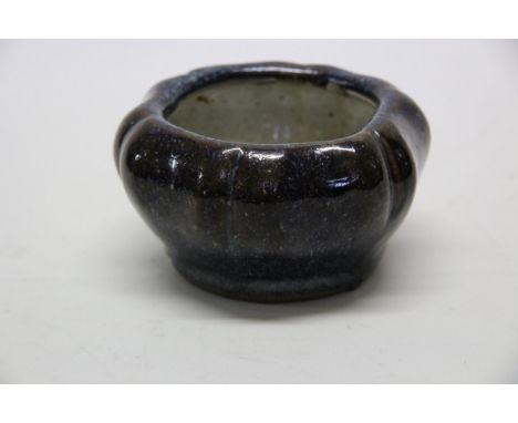 A Chinese flambe bowl, six character seal mark, of lobed form, 12cm diameter.   Condition Report:  No damage seen.