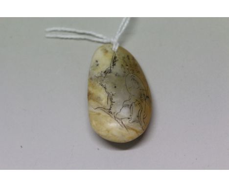 A Chinese jade or hardstone pebble, incised with figures in a landscape and four columns of script, 4cm.