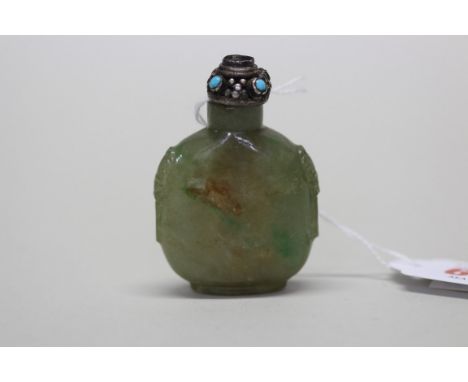 A Chinese mottled green jade snuff bottle, with carved mark shoulders, 5cm high, the white metal stopper with cabochon mounts