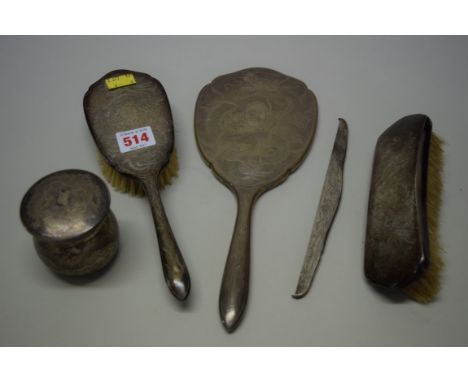 An Oriental silver five piece dressing table set, by 'TH', stamped '85', comprising: a hand mirror; a circular box and cover;