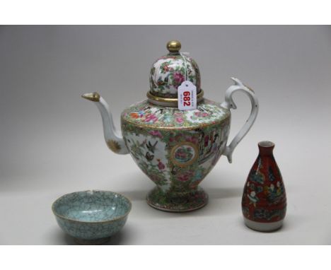 A Chinese Canton famille rose large teapot and cover, 19th century, 26cm high, (repaired); together with a Song style small b