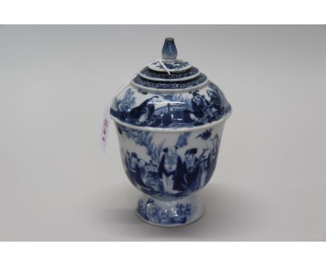 A Chinese blue and white pedestal cup and cover, probably 18th century, painted with figures in a landscape, 16.5cm high. Con