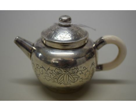 A Chinese silver miniature teapot & cover or water dropper, maker's mark, with ivory handle, engraved with floral scrolls, 7c