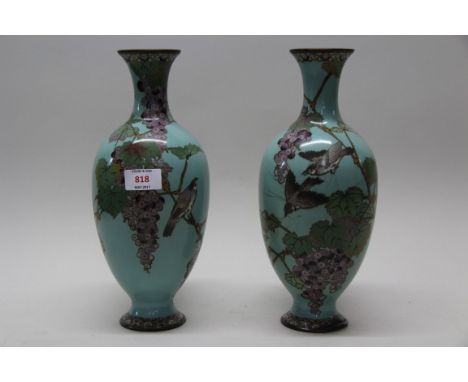 A pair of of Japanese cloisonne enamel vases, decorated with fruiting vines, 30.5cm high. (2)