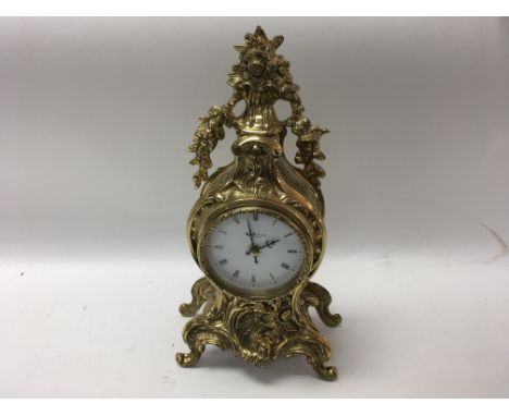 A 20th century brass mantle clock by Robert Grant of London with a quartz movement. Height approx 33cm - NO RESERVE