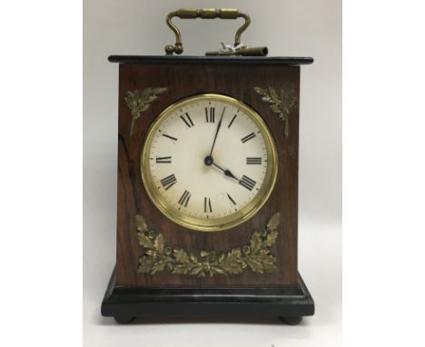A small Edwardian mahogany and rosewood cased mantle clock with gilt brass decoration. H.18.5cm